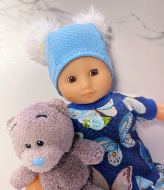 Ca 25 cm pikkune pehme kehaga nukk riiete ja karuga